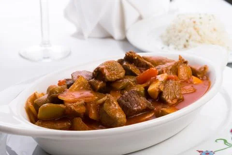 Beef stew served with side white rice pilaf Stock Photos
