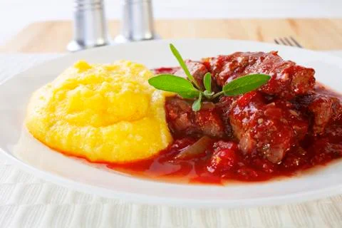 Beef stew with soft polenta Stock Photos