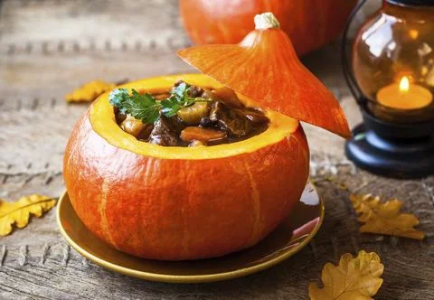 Beef stew with vegetables in pumpkin Stock Photos