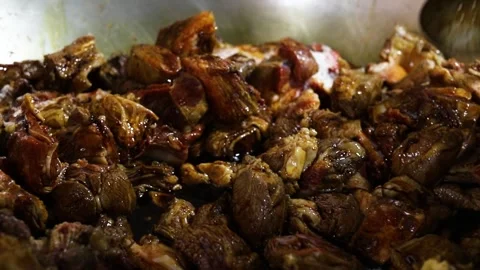 The beef is stirred in the cauldron Stock Footage 243433256