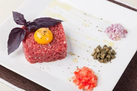 Beef tartar with egg Stock Photos
