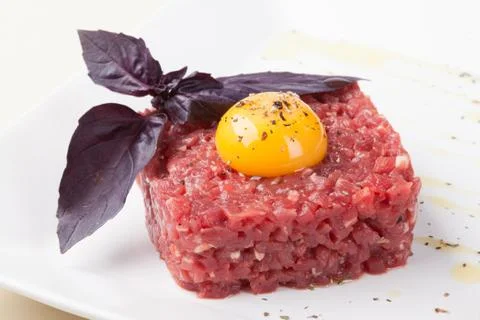 Beef tartar with egg Stock Photos