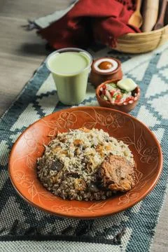 Beef Tehari Combo with shami kabab tikki, salad, borhani and baked gulab ja.. Stock Photos