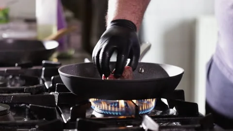 Beef tenderloin steak fried in small frying pan - close-up Stock Footage 157496108