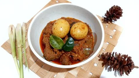 Beef Toppa Lada with eggs served in a white bowl Stock Photos