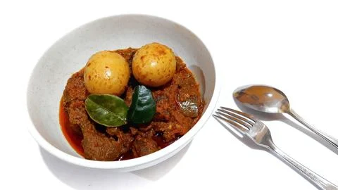 Beef Toppa Lada with eggs served in a white bowl Stock Photos