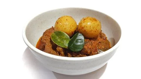 Beef Toppa Lada with eggs served in a white bowl Stock Photos