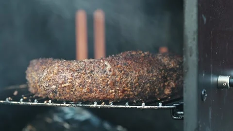 Beef tri tip smoking outside Stock Footage 260753595