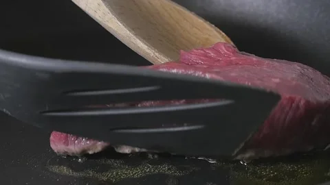 Beef Turning in Cooking Pan Slow Motion Stock Footage 169612295