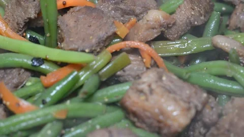 Beef with vegetables. asian food style. close-up of steam over a dish. soft vari Stockbeeldmateriaal 149840407
