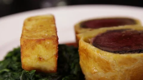 Beef Wellington with fried potatoes and Spinach. Stock Footage 130865341