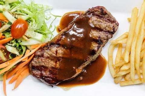 Beefsteak with fried potato Stock Photos