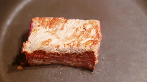 Beeft steak cooking on frying pan Stock Footage 68809687
