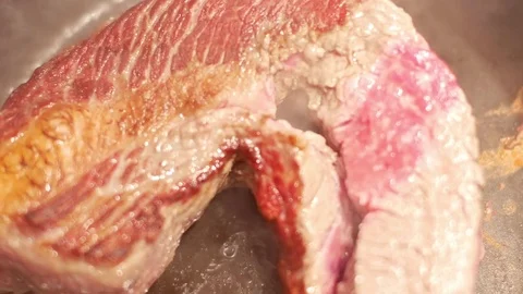 Beeft steak cooking on frying pan Stock Footage 72667741