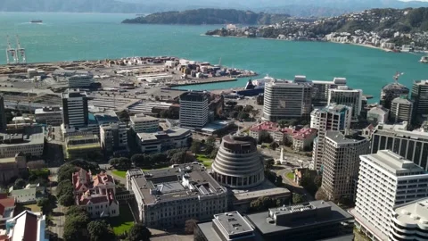 Beehive in Wellington. Aerial pull back from famous parliament building in Stock Footage 212308414