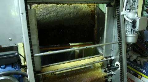 Beekeeper extracting honey with machine in home Video stock 54235673