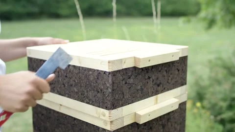 Beekeeper Placing Steel Tool on Cork Hive Rim, Green Summer Garden, Close Up Stock Footage 341296509