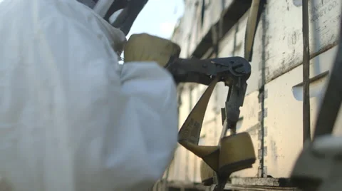 Beekeeper tightening straps of beehive boxes Stock Footage 50167077
