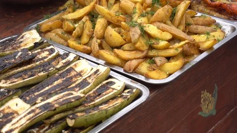 Beer 1A lot of rustic potatoes and grilled vegetables on trays Stock Footage 124230129