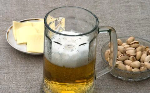 Beer and appetizer. Stock Photos