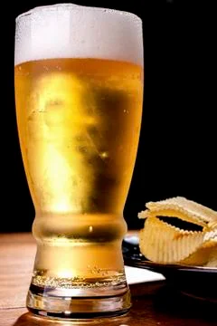 Beer and chips. Stock Photos