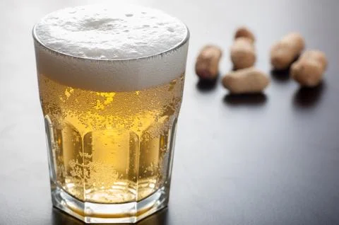 Beer and nuts Stock Photos
