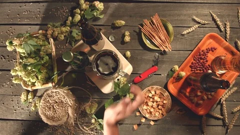 Beer and a variety of snacks on the table. Видео 79867136