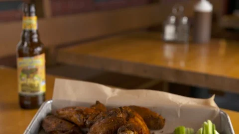 Beer and wings with celery  Stock Footage 112576224