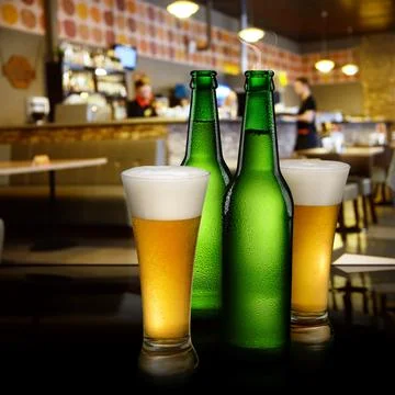 Beer in bar interior Stock Photos