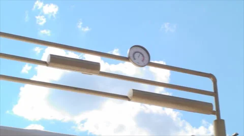 Beer Barometer With A Beautiful Blue Sky And White Fluffy Clouds, Pan Stock Footage 39965962