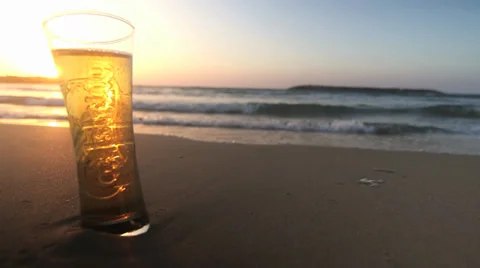 Beer on the beach at sunset 02 Stock Footage 32889296