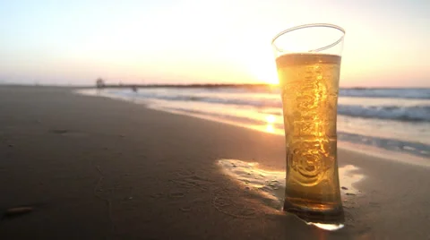 Beer on the beach at sunset Stock Footage 32703568