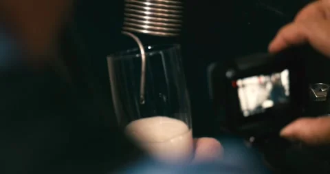 Beer being filled into glass close up in industrial factory brewery Stock Footage 335142394