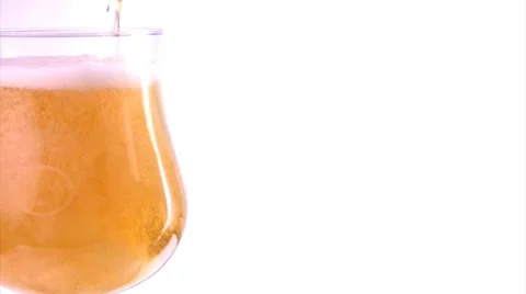 Beer being poured on a white background Stock Footage 8509925