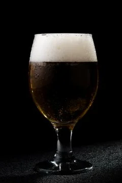 Beer on black Stock Photos