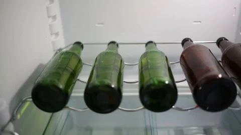 Beer bootles in a refrigerator Stock Footage 82862458