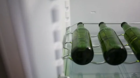 Beer bootles in a refrigerator Video stock 82862482