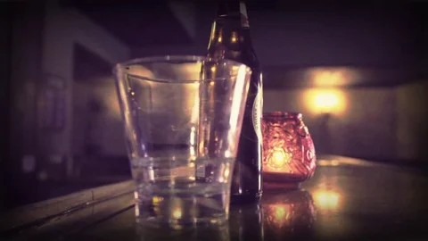 Beer Bottle with Candle in the Background 動画素材 71504043
