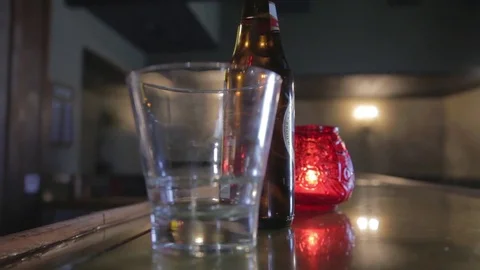 Beer Bottle with Candle in the Background 動画素材 71504402