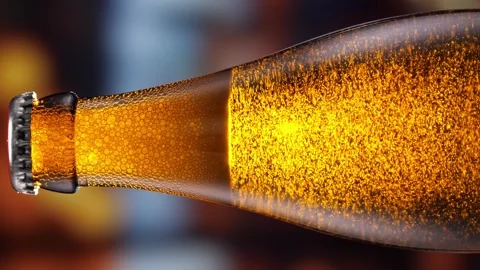 Beer bottle featuring lively bubbles and frothy foam, bar counter in background Stock Footage 282209112