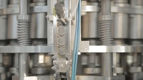 Beer bottles cap machine in the factory Stock Footage 114699638