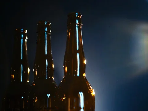 Beer bottles on a dark background Stock Footage 73440983