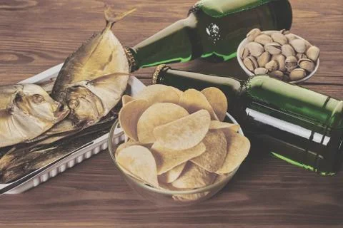 Beer in bottles with snack Stock Photos