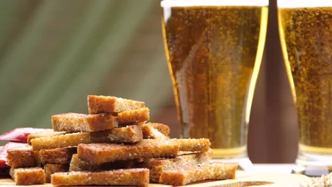 Beer with bubbles in beer glasses and snacks Stock Footage 88523987