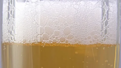 Beer bubbles in a glass close-up Stock Footage 123860195