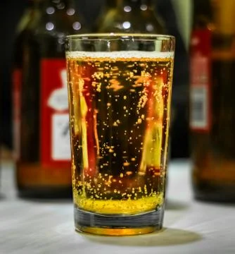 Beer Bubbles in a Glass on a Table in a Pub, 4K Stock Photos