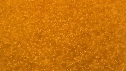 Beer bubbles in a glass, waves, bubbles and foam Stock Footage 227855913