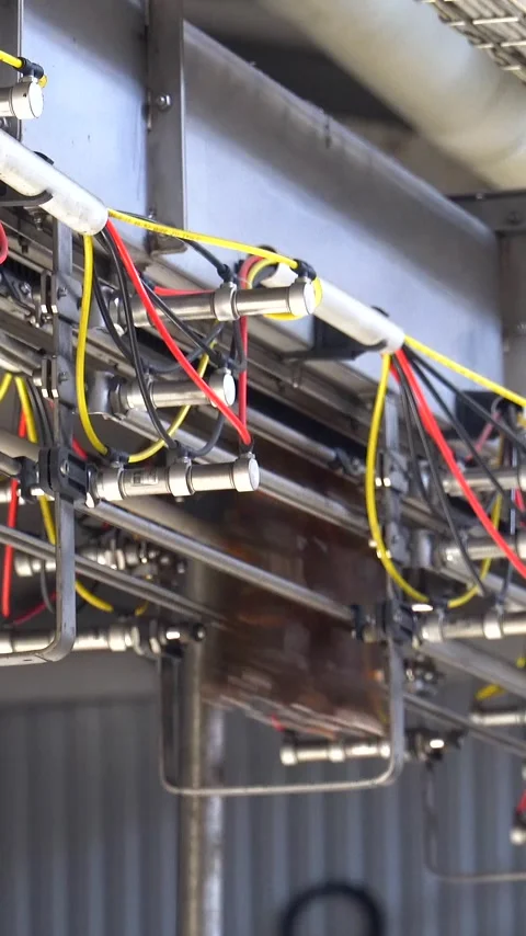 Beer cans are moving along the conveyor beltTechnological line for bottling of Stock Footage 310632579