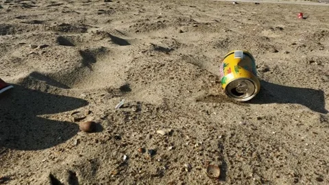 Beer cans covered in dust on the beach. Stock Footage 250801059