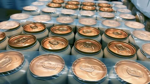Beer Cans Packed in Shrink Wrap Blocks at Wholesale Warehouse. Aluminum Beverage Stock Footage 315478702